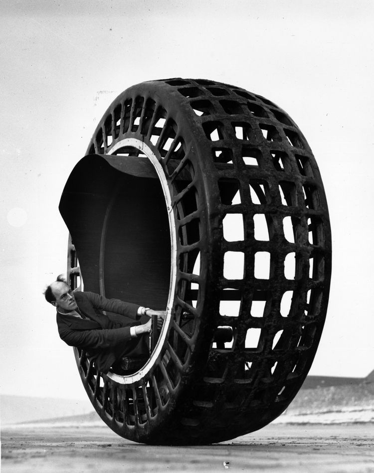 The Dynasphere, an electrically-driven wheel, capable of speeds of 30mph, being tested on the beach at Weston Super Mare by Mr J. A. Purves of Taunton, who invented the machine with his son.   (Photo by Fox Photos/Getty Images)